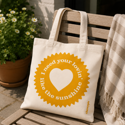 Wit-gele canvas strandtas "I need your lovin"